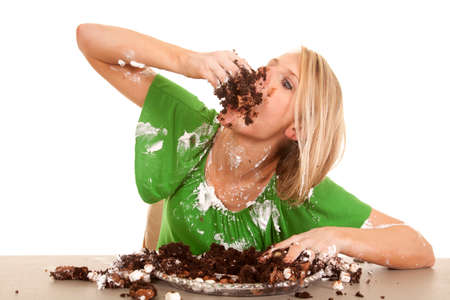 28112553-a-woman-stuffing-her-face-with-chocolate-cake-she-is-covered-all-over-in-frosting-and-cake-.jpg